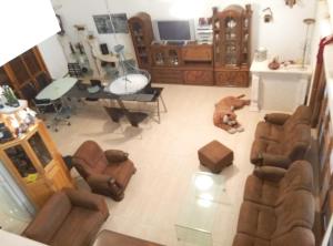 an overhead view of a living room with couches and a table at Castel Ashkelon in Ashqelon