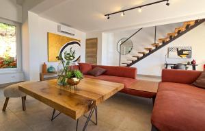 a living room with a couch and a table at Lovely Home In Jadranovo With Wifi in Jadranovo