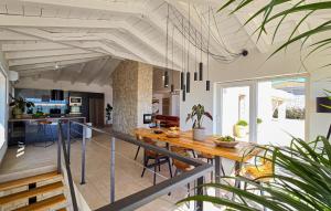 a kitchen and living room with a wooden table at Lovely Home In Jadranovo With Wifi in Jadranovo