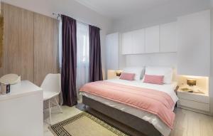 a hotel room with a bed and a desk at 4 Bedroom Cozy Home In Mihatovici in Rošini +22 photos