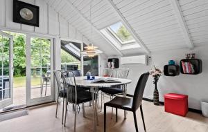 a dining room with a table and chairs at Awesome Home In Skjern With Wifi in Skjern