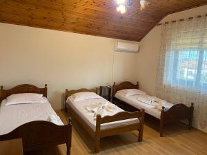 Ένα ή περισσότερα κρεβάτια σε δωμάτιο στο The Hideaway Guesthouse