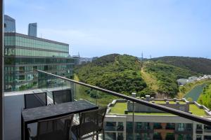 a balcony of a building with a view of a mountain at Radisson Residences Vadistanbul in Istanbul