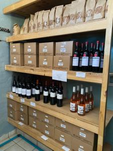 a shelf with bottles of wine on it at Seaside Vacation Studio @ Shearwater Myoli Beach in Sedgefield