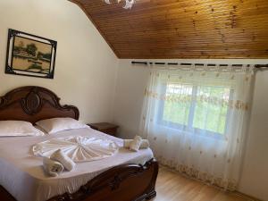Ένα ή περισσότερα κρεβάτια σε δωμάτιο στο The Hideaway Guesthouse