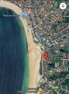 a map of a beach with a red circle at PRIMERA LINEA PLAYA AMERICA in Nigrán +17 photos