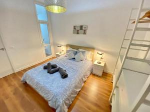 a bedroom with a bed with a teddy bear on it at Apartment Karin in Arona