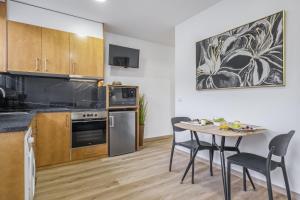 Kuchyň nebo kuchyňský kout v ubytování Colinas by Homie + 13 fotografií