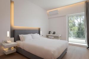 Postel nebo postele na pokoji v ubytování Mirada Hotel