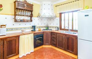 a kitchen with a sink and a dishwasher at Cozy Home In El Gastor in El Gastor