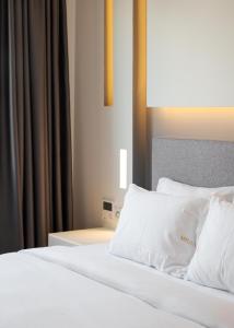 Postel nebo postele na pokoji v ubytování Mirada Hotel