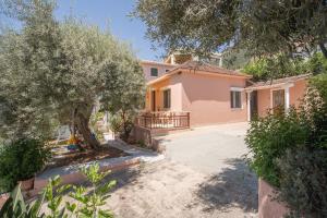 a villa with a view of the driveway to the house at GAIA The Cottage House in Nydri