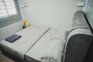 Кровать или кровати в номере Redang Bro Roomstay 3 +1 фотография