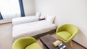 Postel nebo postele na pokoji v ubytování Ayanishiki大阪西九条STAY