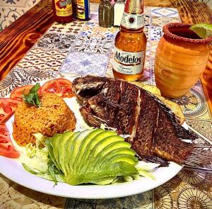 a plate of food with meat and vegetables on a table at Express Inn in Durant