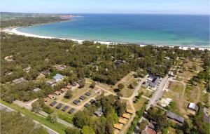 an aerial view of a house next to the beach at Nice Home In Nexø With Wifi in Neksø +9 photos