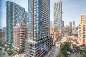 an aerial view of a city with tall buildings at RivetStays - The Jarvis in Toronto