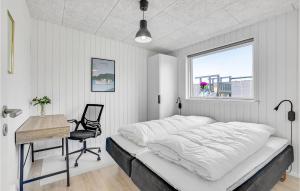 a bedroom with a bed and a desk and a window at Gorgeous Home In Løgstrup With Kitchen in Løgstrup +18 photos