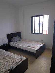 Ένα ή περισσότερα κρεβάτια σε δωμάτιο στο Saida FamilySeasideResort