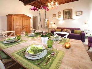 a dining room with a table with plates of food at Nostromondo Apartments Rome City Centre in Rome