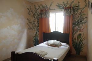 Postel nebo postele na pokoji v ubytování Cataleya Hostel