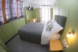 Ένα ή περισσότερα κρεβάτια σε δωμάτιο στο Lu De Anda Hotel Boutique