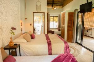 Postel nebo postele na pokoji v ubytování LA QUEBRADA ECO LODGE Hotel Boutique