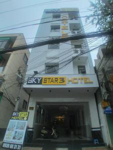 a hotel with a sign in front of a building at Sky Star 3 Hotel in Can Tho