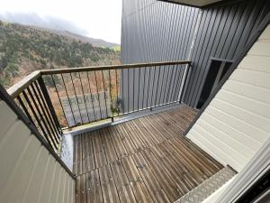 a balcony with a view of a mountain at Appartement 2 chambres proche pistes avec balcon et parking gratuit - FR-1-787-14 in Saint-Jacques-des-Blats +2 photos
