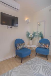 TV a/nebo společenská místnost v ubytování Vila Luz Mar