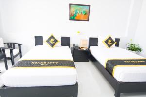 Postel nebo postele na pokoji v ubytování Hoang Long Hotel Phan Thiết