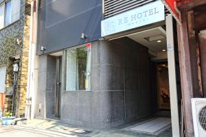 a building with a sign that reads be hotel at RE Hotel 谷町9丁目 in Osaka