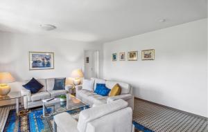a living room with two couches and a table at Lovely Apartment In Kühlungsborn in Kühlungsborn