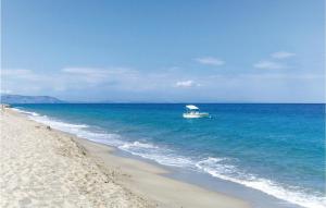 a boat in the water on a beach at Villa Edvige in Nocera Terinese