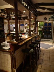 a bar in a restaurant with stools at a counter at Haus zum Nöckel in Schalksmühle +6 photos