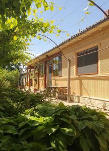 a house with a porch and a patio at Casa Nautica in Jurilovca