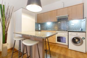 A kitchen or kitchenette at Portal Del Angel Barcelona Apartment