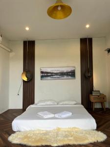 3pok-Riverside maewangjinxiang客房内的一张或多张床位