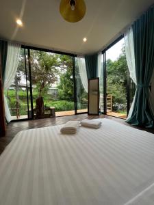 3pok-Riverside maewangjinxiang客房内的一张或多张床位