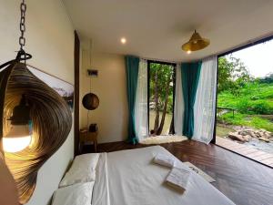 3pok-Riverside maewangjinxiang客房内的一张或多张床位