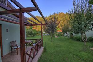 a patio with a table and chairs in a yard at Dalya Life in Göcek