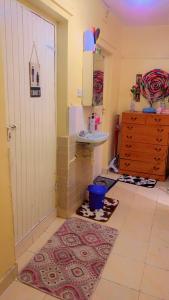 a bathroom with a sink and a sink at 7 Mogotio in Nairobi