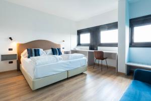 Voodi või voodid majutusasutuse Hotel Saccardi & Spa - Adults Only toas