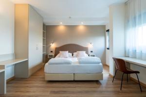 Voodi või voodid majutusasutuse Hotel Saccardi & Spa - Adults Only toas