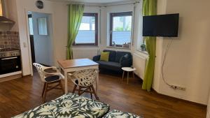 TV a/nebo společenská místnost v ubytování Apartment Erfurt-Marbach