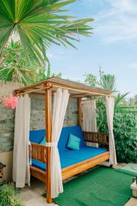 a bed in a gazebo on a patio at Tap One Villa Ubud in Ubud