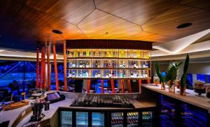 a bar with a lot of bottles of alcohol at The Park Visakhapatnam in Visakhapatnam