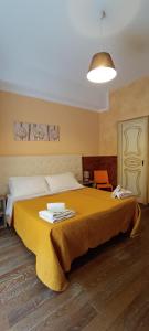 Postel nebo postele na pokoji v ubytování B&B Camere e Cassata