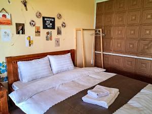 Postel nebo postele na pokoji v ubytování Robins Guesthouse