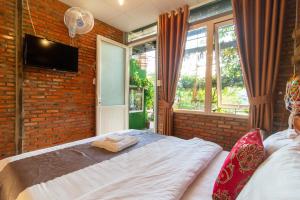 Postel nebo postele na pokoji v ubytování Robins Guesthouse